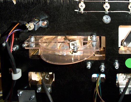 Behind the back panel