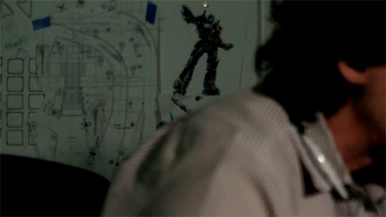 George working at his desk but what's on the wall behind? 