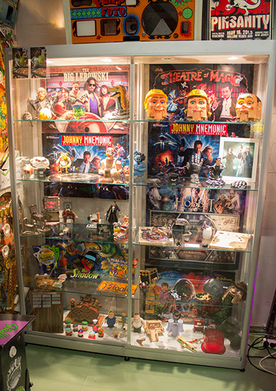 A display case packed with pinball artefacts