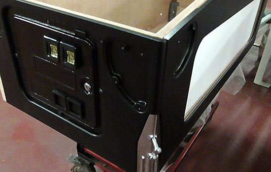 The recessed legs on the matt black cabinet