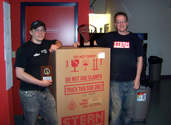 Cayle and Sean with the winner's prize of a new NBA machine