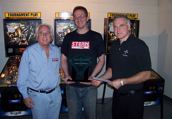 Sean receives his winner's trophy
