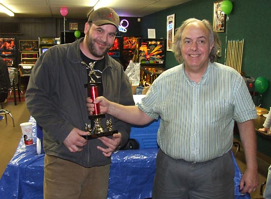 Jeff receives his Pinball Circus tournament trophy from Lloyd