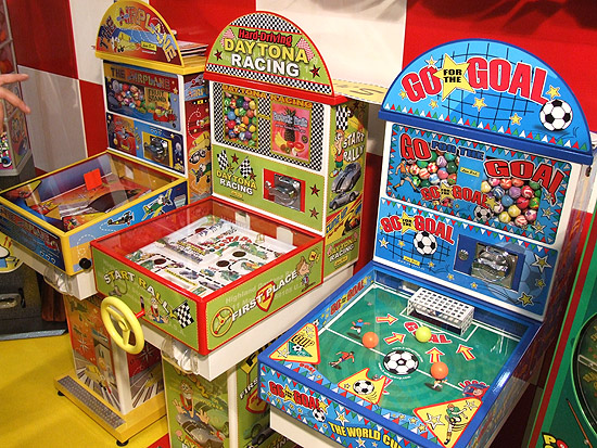 Assorted prize dispensors, 2 with a simple pinball theme