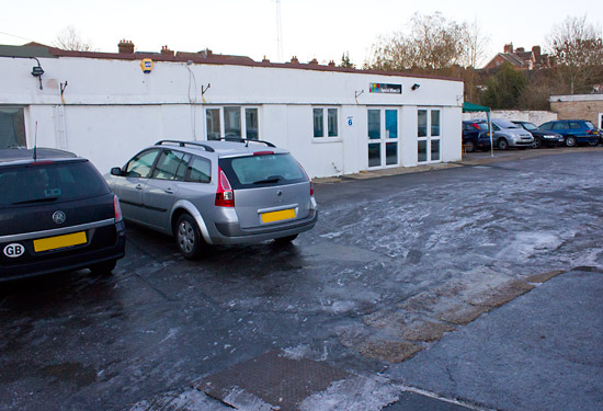 Ice covered the car park with snow further afield
