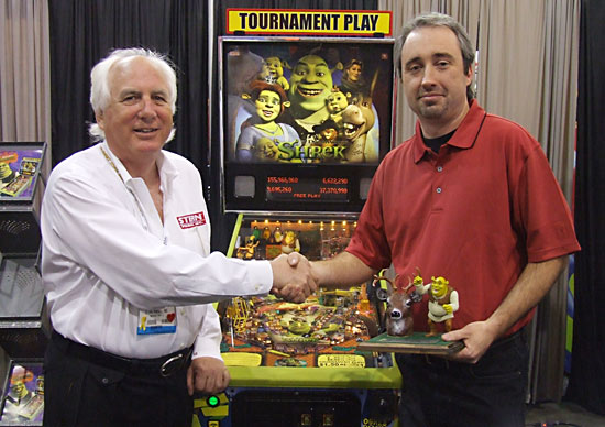Jim receives his trophy from Gary Stern