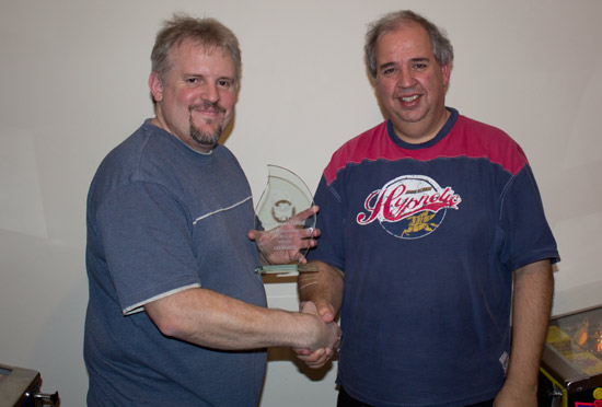 Martin presents Andy with his winner's trophy