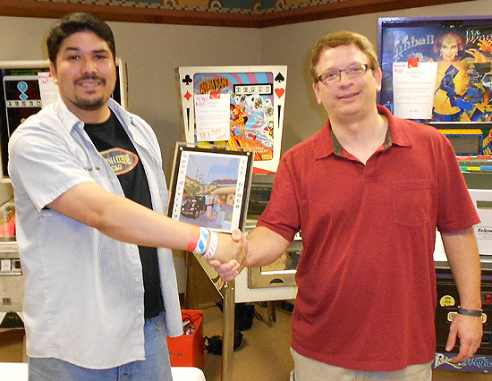 Jonny O presents the first place trophy to Open winner Kevin Martin
