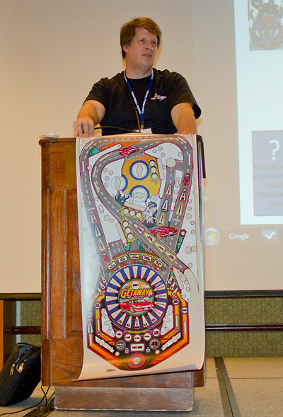Rick shows the playfield artwork for High Speed 2 - The Getaway