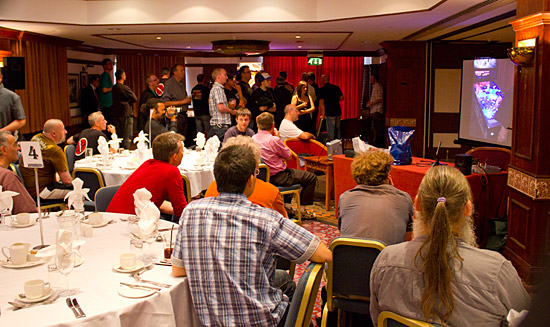 Dinner guests watch the final on the screen