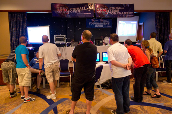 Players check their rankings and the scores on the machines