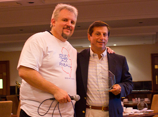 Andrew presents Jack with his induction trophy