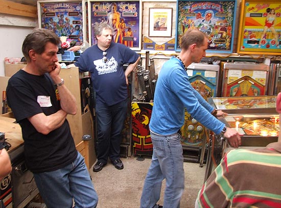 Terry and Mike watch Greg as they play for the top three positions