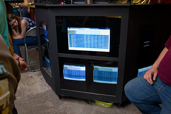 Scores were shown on multiple monitors under the desk