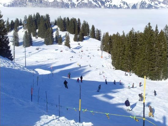 A view down the piste and over the clouds at Flumserberg ski resort