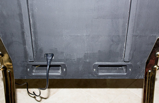 The bottom of the back of the cabinet