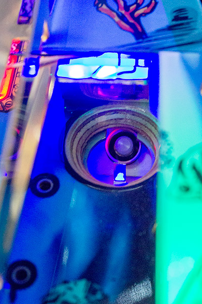 The eject hole on the right of the playfield