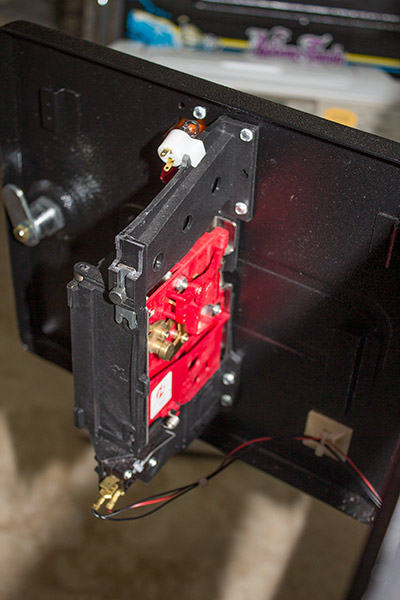 The coin mech supplied with the game