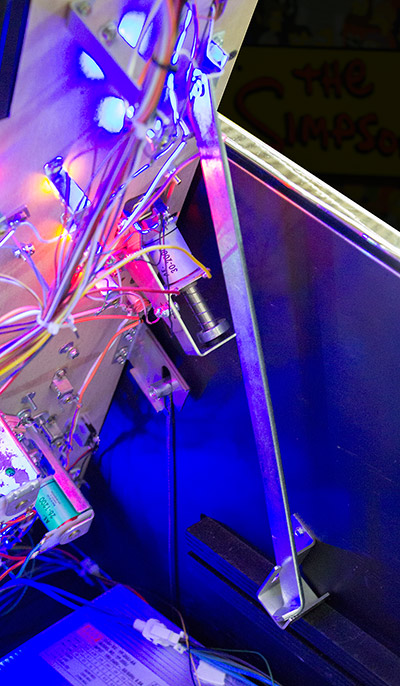 The playfield lifts and can be propped up