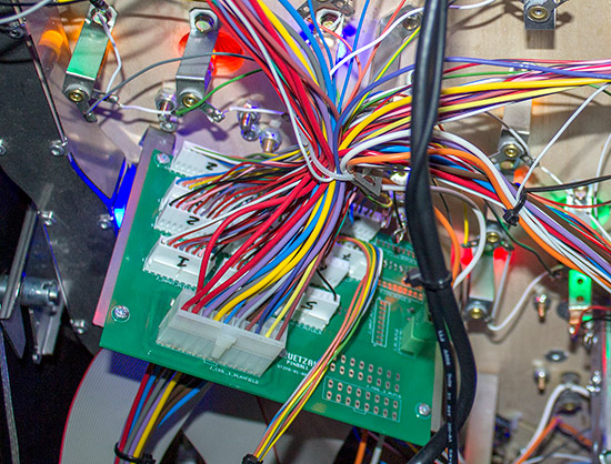 The playfield cables connect to the interface board