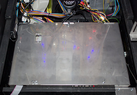 The large metal box in the base of the cabinet