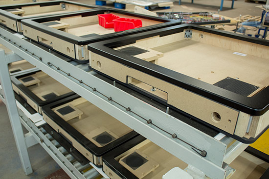 Backbox frames awaiting their metal trim pieces