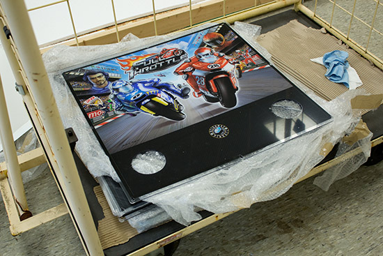 A stack of Full Throttle backglasses