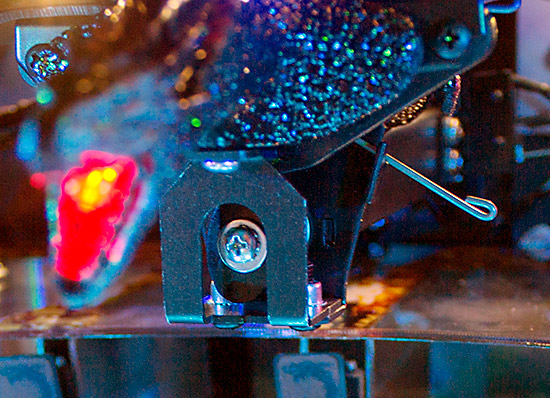 The elliptical cam drives the sprung wings up and down