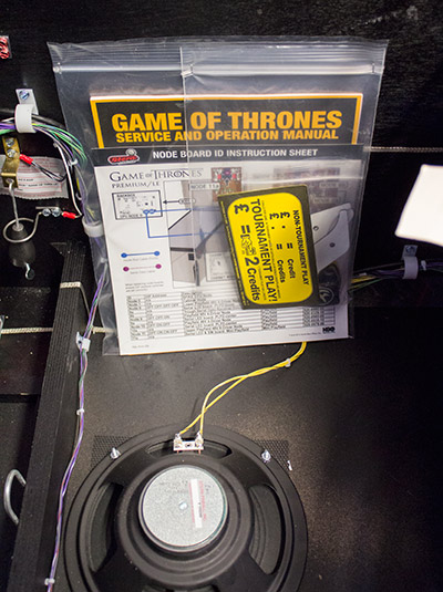 The manual, pricing card and goodie bag provided with the LE