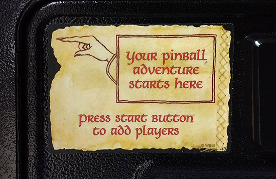 Instruction decal on the coin door