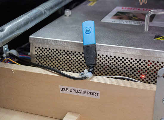 A USB socket is provided inside the coin door
