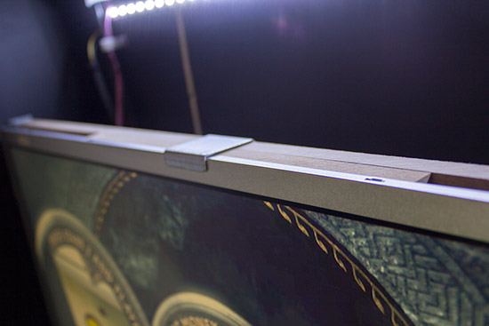 The monitor is mounted on a MDF frame
