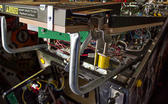 Slide rails under the playfield