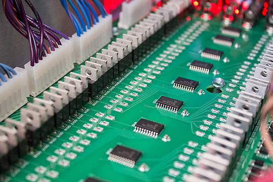 Driver MOSFETS run down either side of the I/O board