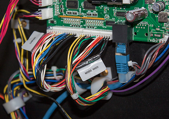 Connections to the playfield, coin door and cabinet 