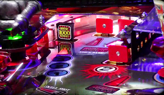 The upper playfield is accessed by the left ramp but a drop-target blocks it