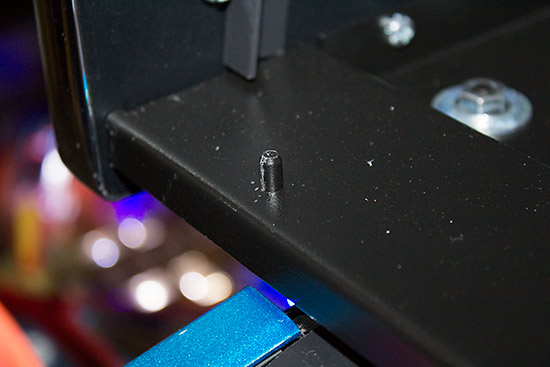 One of the two pins which slot into the speaker panel