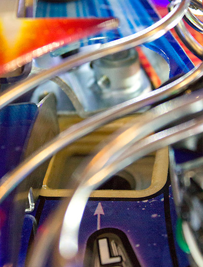 The left eject hole with the deflector rotated out of the way