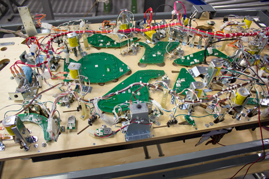 This incomplete playfield shows eight of the nine under-playfield circuit boards