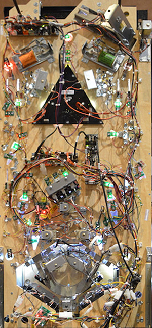 The large cutout in the playfield for the ring mechanism