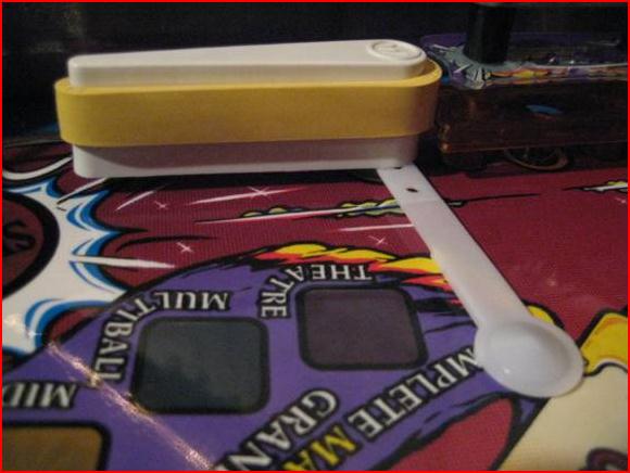 A plastic pop bumper spoon makes an excellent tool to gauge needed free play
