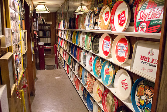 A side corridor features Dan's collection of bar drinks trays
