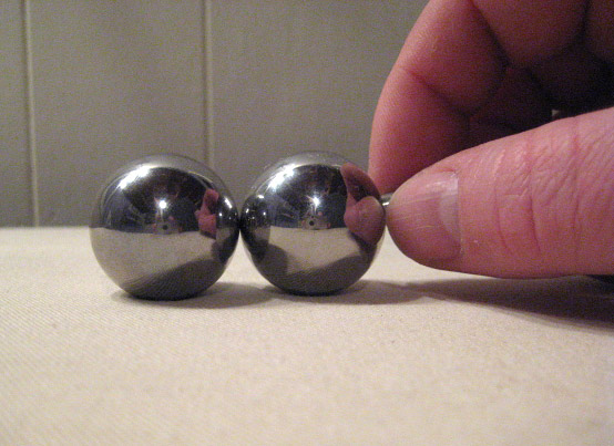 One ball sticks to another