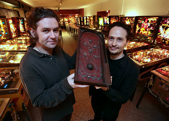 Balázs and Attila with an early bagatelle game