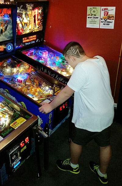 Adam enjoying the pinballs at The Courthouse