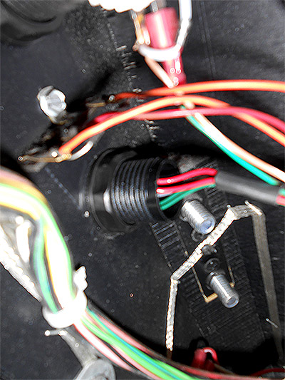 The switch is bolted to the cabinet