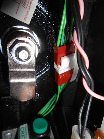 The six-way connector by the coin door