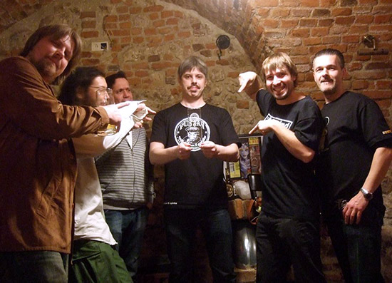 Robert Gałązka in the center with Maciek pointing his fingers