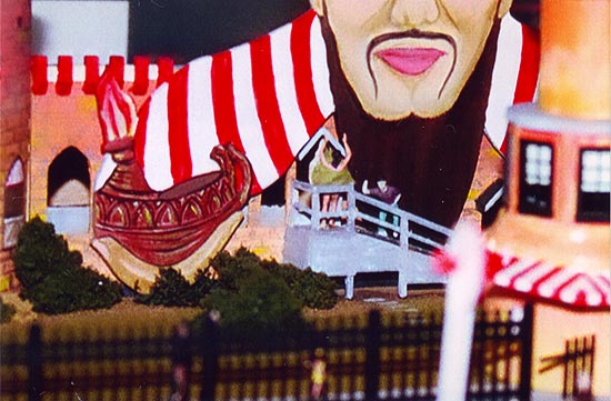 A woman's skirt blowing up on the front left passageway of Ed Fruh's Aladdin's Castle model