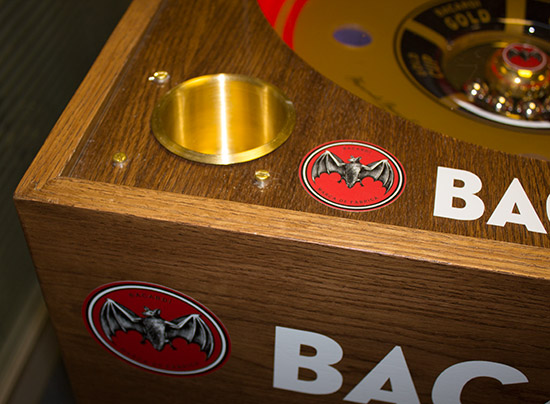 The brass cup holder and solid oak cabinet